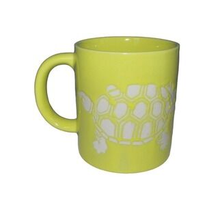 Yellow coffee cup mug white embossed stamped turtle island vacation souvenir